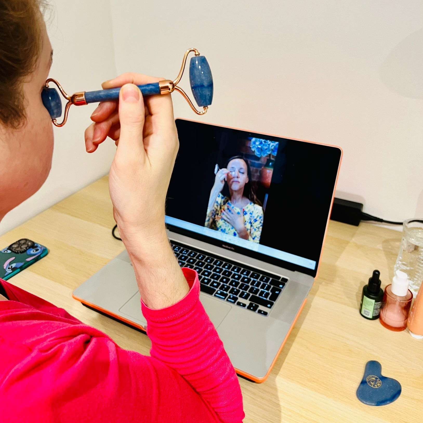 girls learning how to use gua sha and face rollers