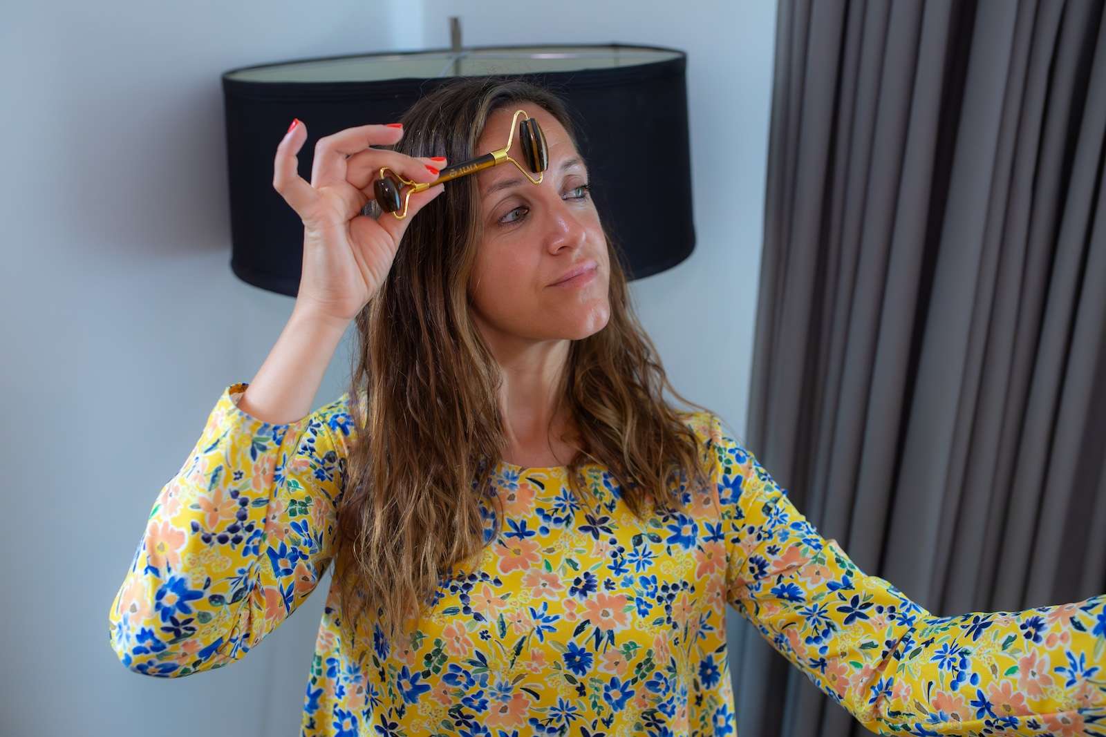alma using a face roller